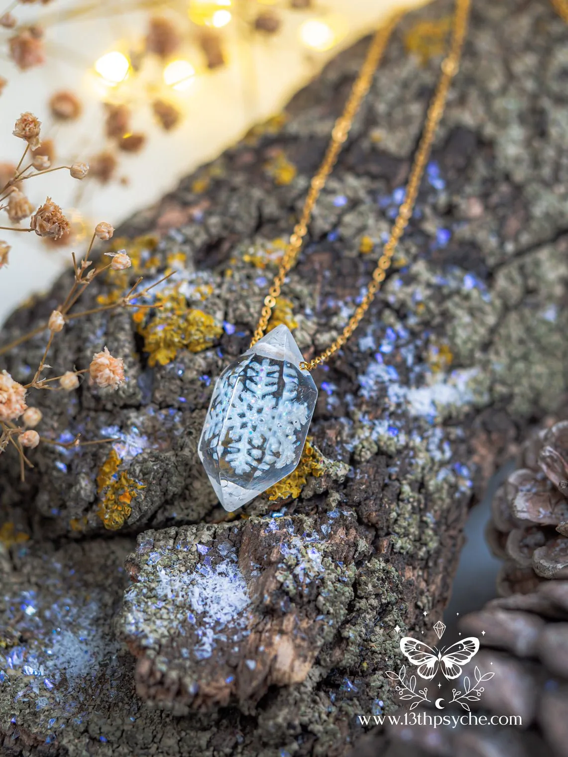 Encased snowflake crystal point pendant necklace